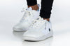Kids wearing Billy White/Navy Sport Court Sneakers with laces and zipper for easy on and off; functional and fashionable design.