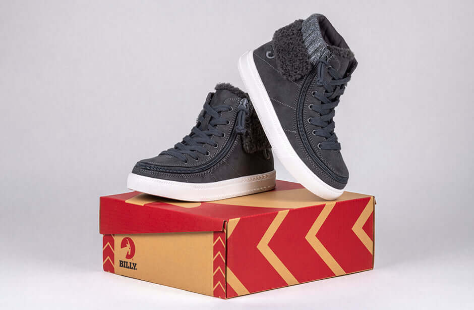 Charcoal Grey BILLY Cuffs high tops with fur collar and zipper, showcasing easy on-off design for kids, atop a branded shoe box.