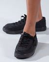 Kids black canvas BILLY shoes with laces and zipper for easy on and off, shown on feet. Functional and fashionable footwear.