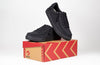 Men&#39;s black canvas shoes, ideal for diabetes, plantar fasciitis, bunions, wide feet, wheelchair use, and orthotics, on box.